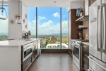 Open Concept throughout the kitchen, dining room, and living room with high ceilings of 10ft and stunning views from every angle